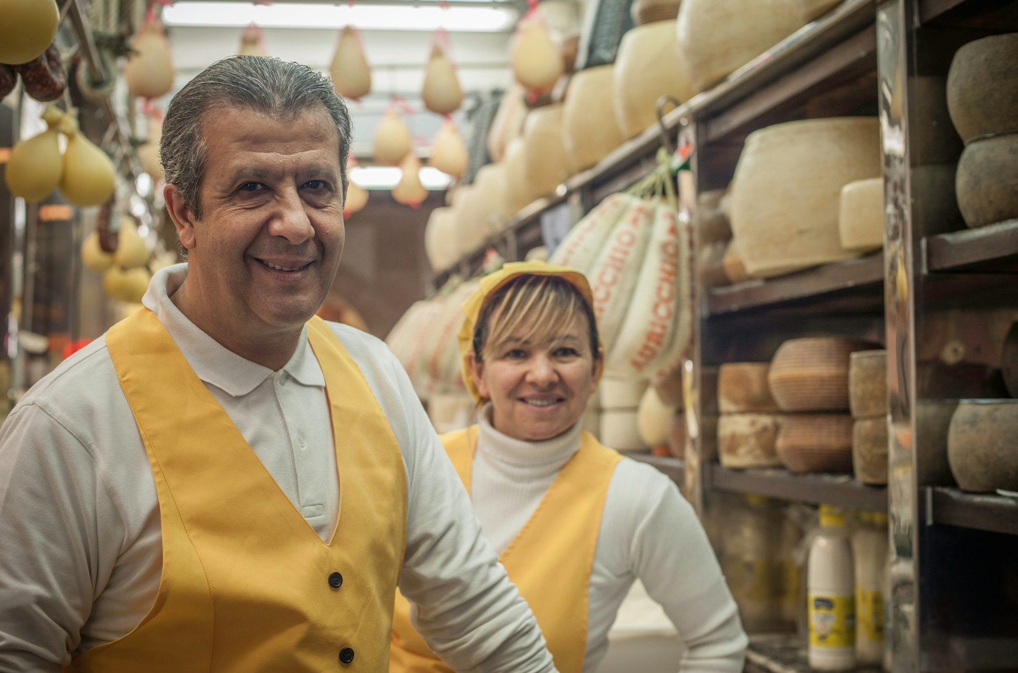 Man and woman in cheese shop